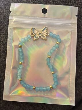 Light Blue Beaded Bracelet with Gold Butterfly Accent